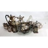 A group of electroplated items to include a three piece foliate scroll embossed tea set, a vine