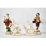 SAXONY; a pair of white glazed porcelain figures, and a pair of Dresden style figures of a dandy and