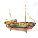 A scratch built fishing trawler with miniaturised detail throughout, hull painted in red and black