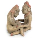 A pre-Columbian type erotic figure group with coloured detail, height 18cm (af). Additional