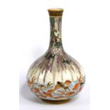 NAMBE; a Japanese Satsuma bottle vase with Greek Key decorated rim above wisteria, with lower