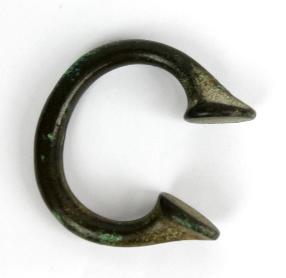 A West African bronze Okpoho/Manilla, diameter 6cm.