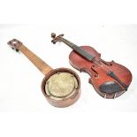 A half size Maidstone violin, length of back 31.5cm, cased with a bow (af), also an unbranded