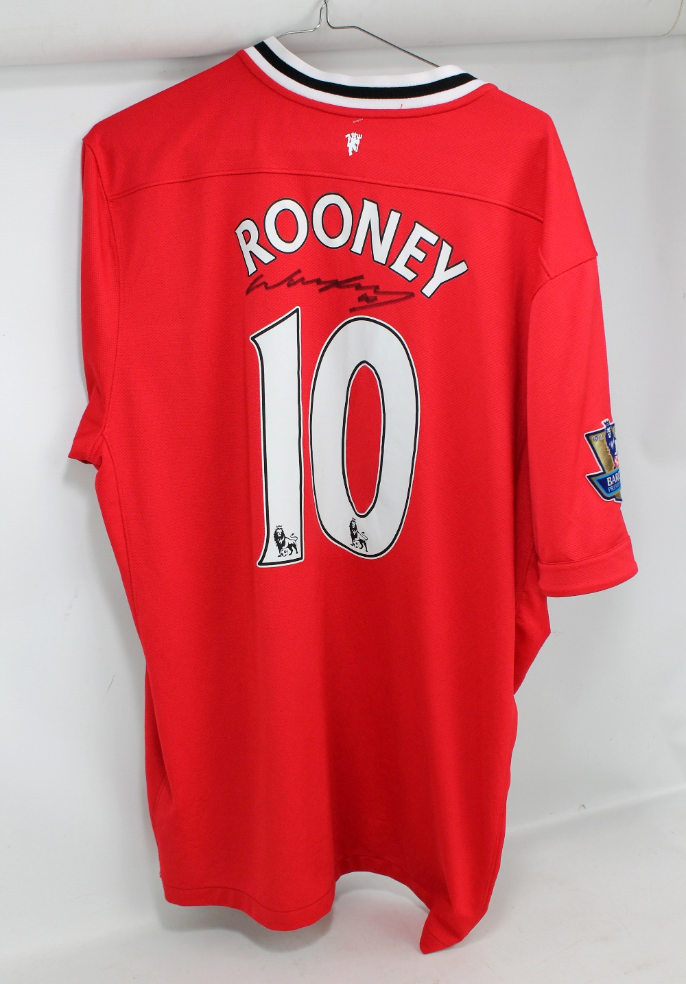 WAYNE ROONEY; a signed Manchester United replica home shirt, size XL.