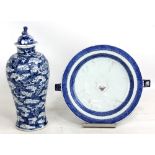 A late 19th century Chinese blue and white painted baluster vase and cover, the body decorated