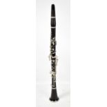An ebony B-flat clarinet, with white metal mounts, stamped 'Made in England 98756', cased.Additional