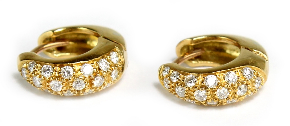 A pair of yellow gold diamond pavé set hoop earrings, approx 6.2g, sold with original purchase