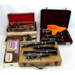 A group of clarinets, spare parts and accessories including Buffet and Berkeley examples.