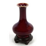 A late 19th century Chinese porcelain sang de boeuf glazed bottle vase, unmarked, height 20.2cm,