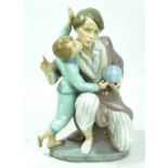 LLADRO; a figure group of father and son, printed marks to base, height 24cm.Additional
