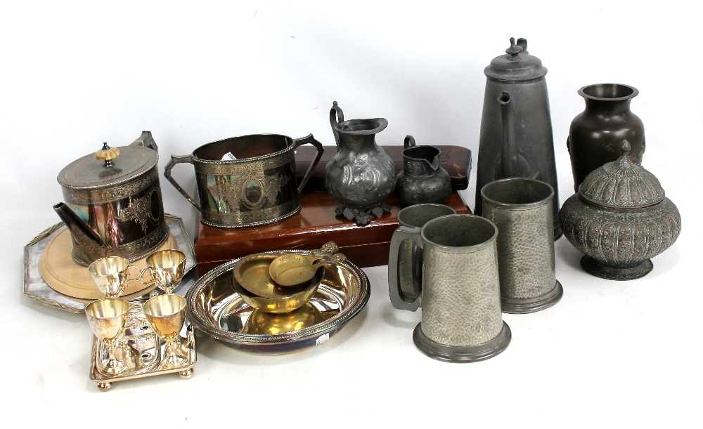 A group of electroplated items to include a teapot with matching sugar bowl, a circular entree dish,