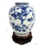 A large Japanese 17th century blue and white painted vase decorated with two stylised animals