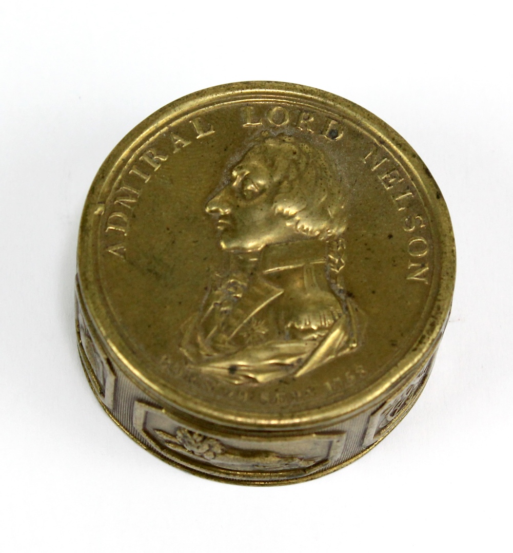 A brass circular commemorative box inscribed 'Admiral Lord Nelson born 29 Sept. 1758', diameter 5.