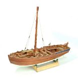A scratch built model boat with mast and three cannons on plinth base, length approx 59.5cm.