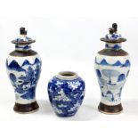 A near pair of early 20th century Chinese porcelain vases painted in underglaze blue with figural