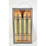 AFTER FRANK LLOYD WRIGHT; a panel of stained glass adopted from a design by Lloyd Wright and