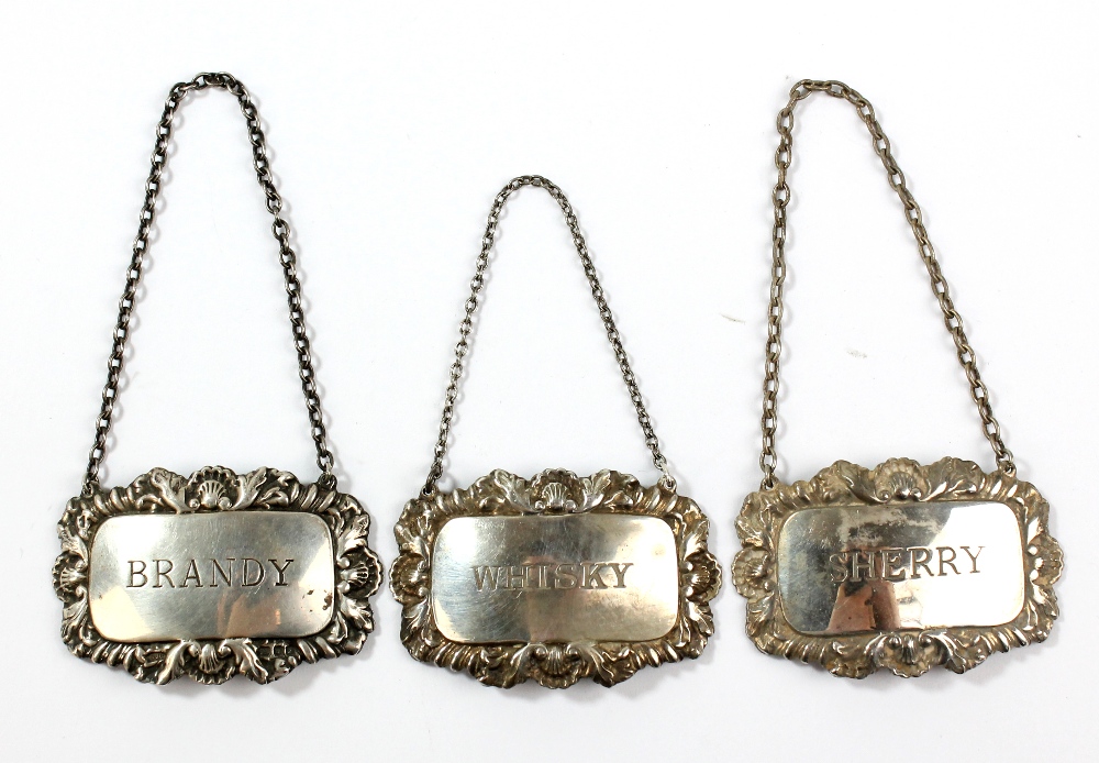 HAMPTON UTILITIES; a pair of Elizabeth II hallmarked silver decanter labels inscribed 'Whisky'