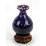 A late 19th century Chinese purple glazed porcelain baluster vase, unmarked, height 19.5cm (af),