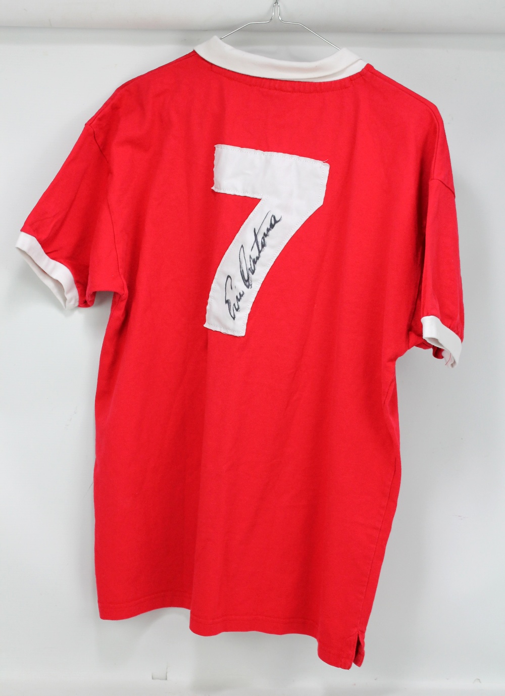ERIC CANTONA; a replica vintage style Manchester United shirt, signed and number '7' to reverse,