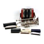 BOOSEY & CO LTD; a silver plated 'Solbron' cornet no. 136858 (lacking mouthpiece), a concertina