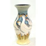 MOORCROFT; a light blue and yellow ground 'Fowlers Farmyard Geese' pattern tubeline decorated