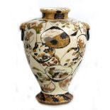 A large Japanese Satsuma baluster vase with everted rim, twin ring mask handles and main body