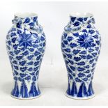 A pair of 19th century Chinese porcelain baluster vases painted in underglaze blue with stylised