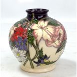 MOORCROFT; a purple and cream ground 'Ophelia's Flowers' pattern tubeline decorated vase,