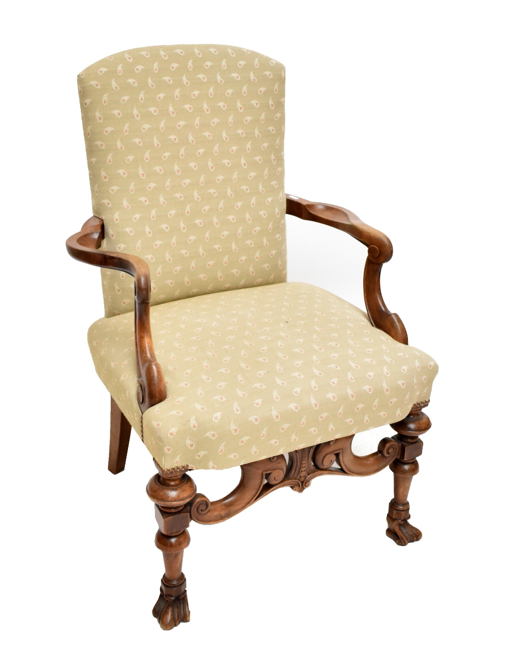 A William and Mary style walnut armchair, upholstered in paisley fabric, the scrolling arms above