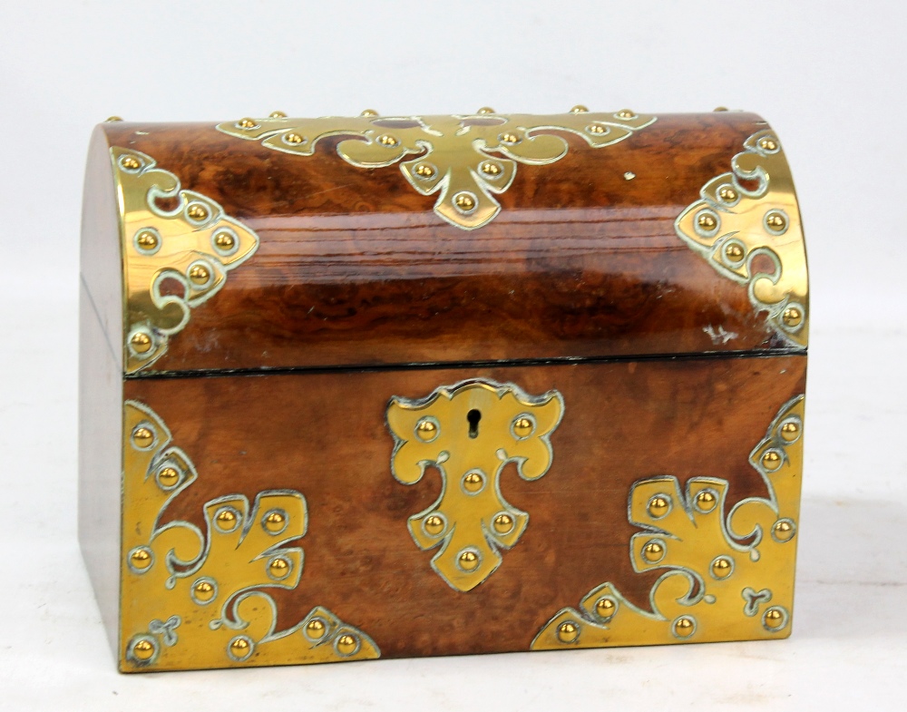 A figured walnut and brass decorated Victorian dome topped two division tea caddy, width 23cm.