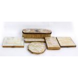 Three mother of pearl mounted powder compacts, a cigarette case, a comb and a brush.Additional