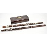 Two rosewood flutes with nickel plated mounts, one cased (2). Additional InformationWear and tear