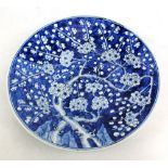 A late 19th century Chinese blue and white floral decorated charger, diameter 37cm (af).Additional