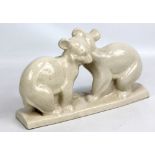 A cream glazed figure group of two marsupials, stamped to base 'L & V Ceram', height 20.5cm.