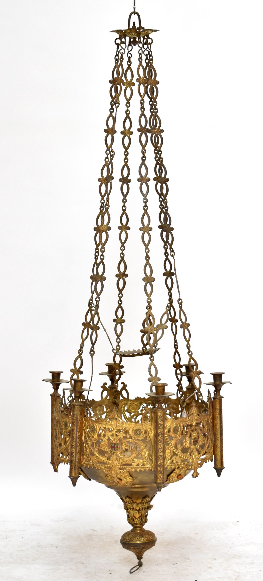 An ornate gilt metal chandelier with pierced and chased foliate detail centred by Maltese cross