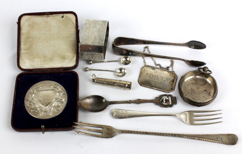 A small group of variously hallmarked silver items to include a pickle fork, Mark Willis & Son,
