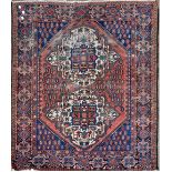 A Hamadan red and blue ground rug, 156 x 122cm.