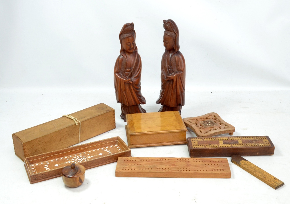 A small group of treen including a pair of Chinese figures, box containing bone and ebony