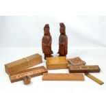 A small group of treen including a pair of Chinese figures, box containing bone and ebony