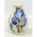 MOORCROFT; a white ground floral decorated baluster vase, with impressed marks and year cipher for