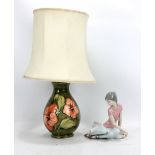 MOORCROFT; a 'Hibiscus' pattern tubeline decorated baluster table lamp, impressed marks and Queen