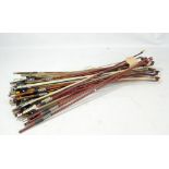 A bundle of assorted violin and cello bows (approximately 30).