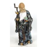 A Chinese ceramic Shoulao (or Shouxing) figure holding staff with gourd in right hand and Peach of