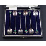 A cased George V hallmarked silver set of six coffee spoons with Art Deco finial set with