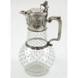 A Victorian cut glass and hallmarked silver claret jug, ovoid body with all-over engraved stars,