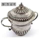 A William & Mary hallmarked silver twin-handled lidded porringer, with faint inscription,