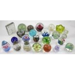 A substantial collection of glass paperweights, various designs, mostly mid-20th century.