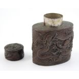 A bronzed Oriental tea caddy with stylised relief decoration, height 11cm.