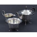 A hallmarked silver three-piece breakfast service, comprising teapot, height 16cm,