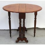 A late 19th century walnut Sutherland table with turned support to porcelain castors, width 69cm.